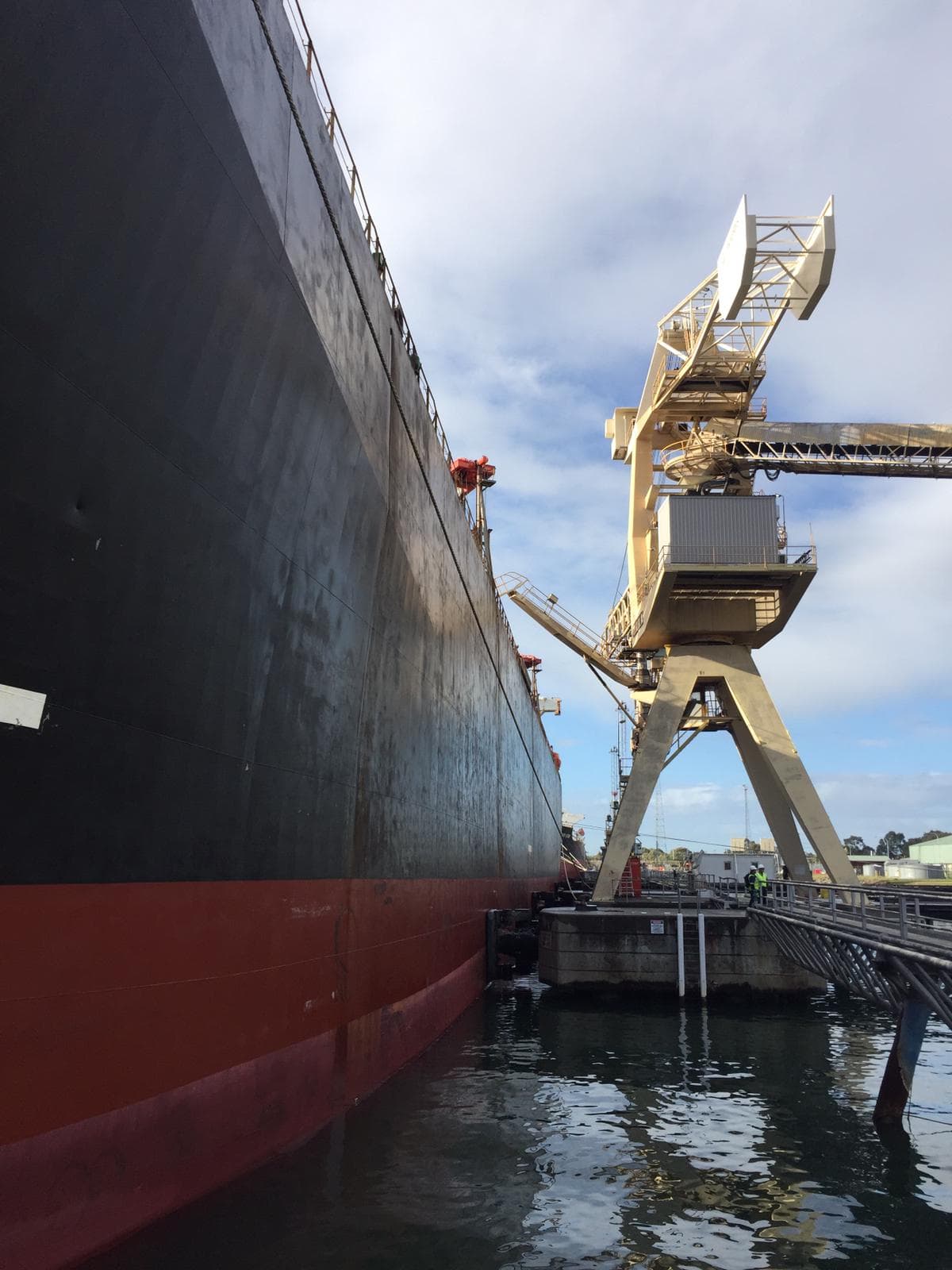 Woodchip carrier at quayside in Western Australia during loading